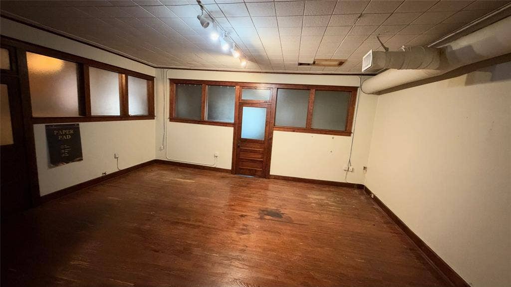 111 E Virginia Street, McKinney, TX 75069 Private office with original hardwood floors and transom door