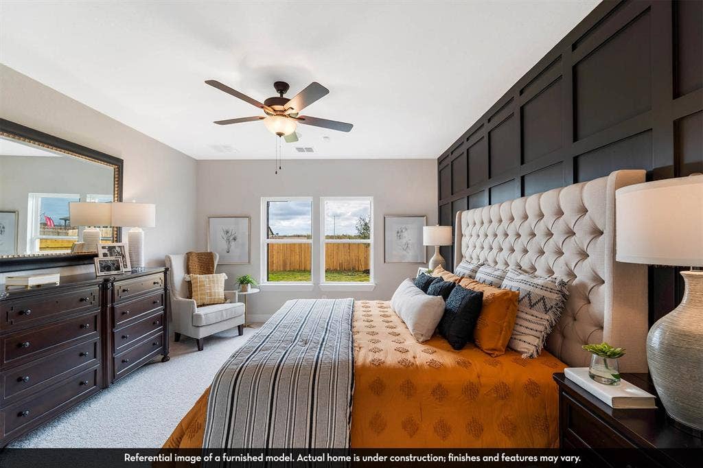 3009 Merrick Drive, Crandall, TX 75114 Dark-toned grid wainscoting accent wall, dual pane windows, and a ceiling-mounted light fixture with integrated fan
