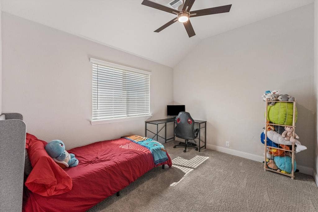 1958 Snowball Lane, Glenn Heights, TX 75154 Bedroom 4 featuring a vaulted ceiling, neutral wall tones, plush wall-to-wall carpeting, horizontal blinds, and a multi-blade ceiling fan with integrated lighting