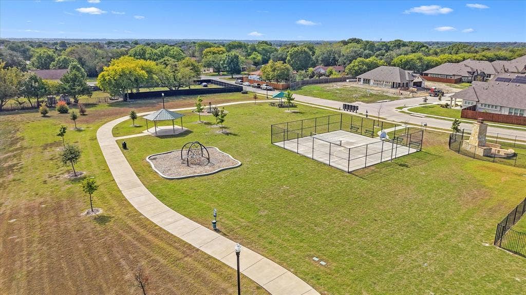 1958 Snowball Lane, Glenn Heights, TX 75154 Community park featuring a fenced sports court, a covered gazebo, a paved walking path, and open green space