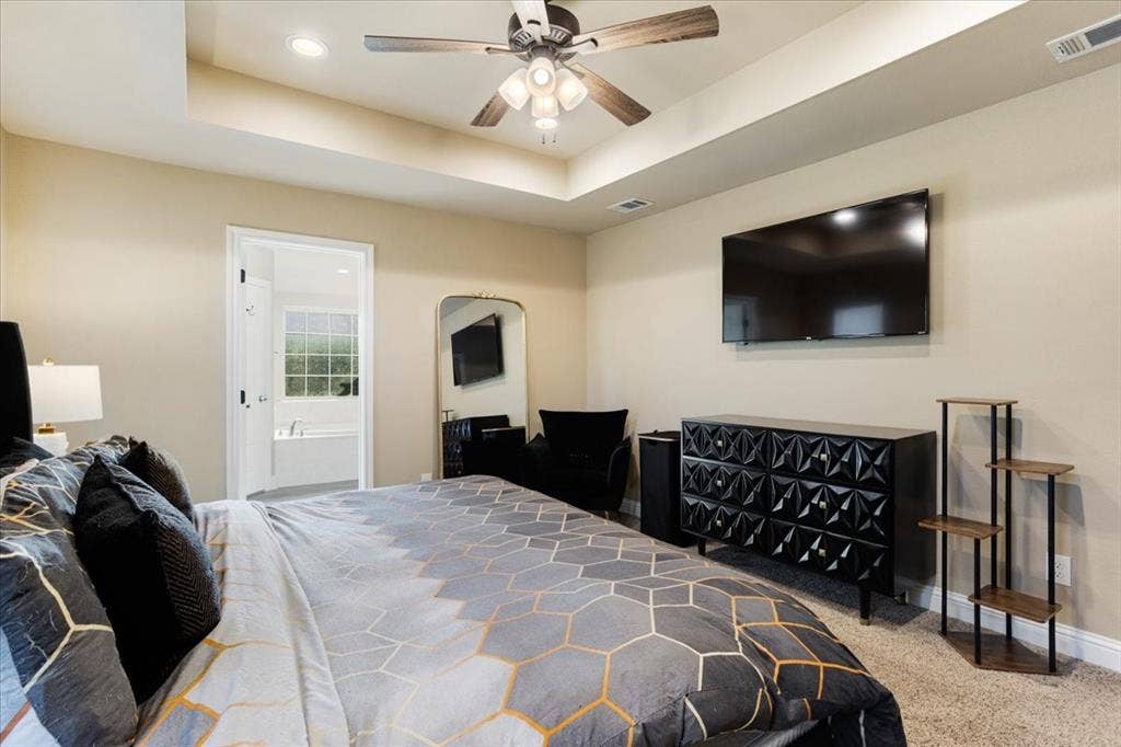 401 Mesa, Lone Oak, TX 75453 Tray ceiling featuring recessed lighting and a central ceiling fan with multi-light fixture