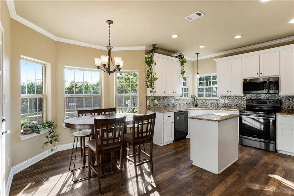 401 Mesa, Lone Oak, TX 75453 Kitchen featuring white shaker-style cabinetry, a central island, stone-finish countertops, patterned tile backsplash, and wood-finish flooring