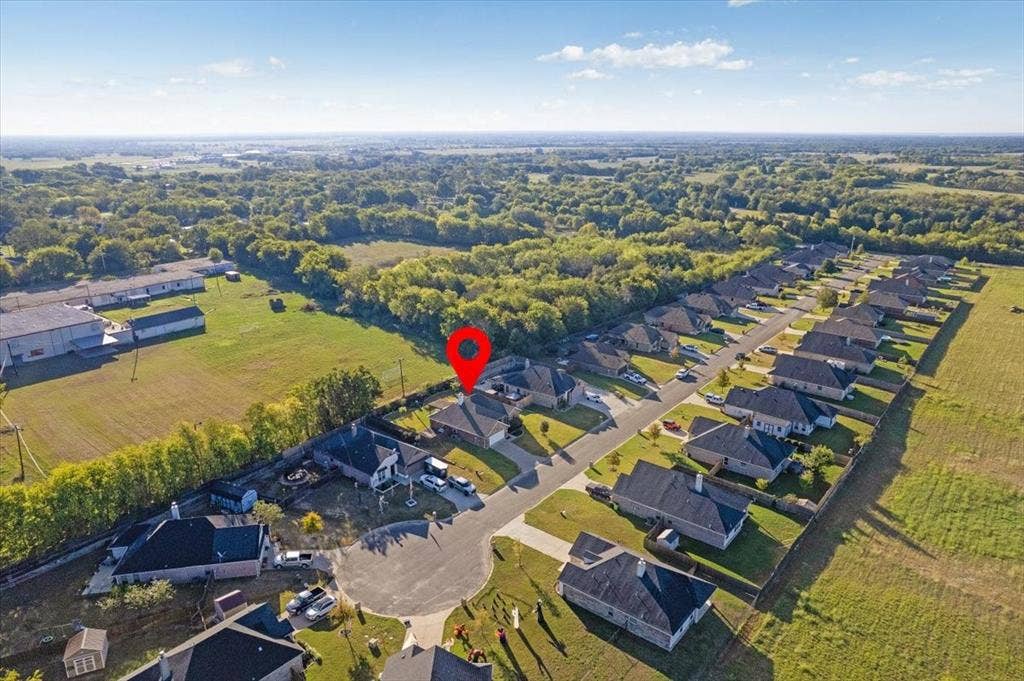 401 Mesa, Lone Oak, TX 75453 Aerial perspective of a single-story residence situated on a cul-de-sac lot, featuring a shingled roof, attached garage, and fenced perimeter