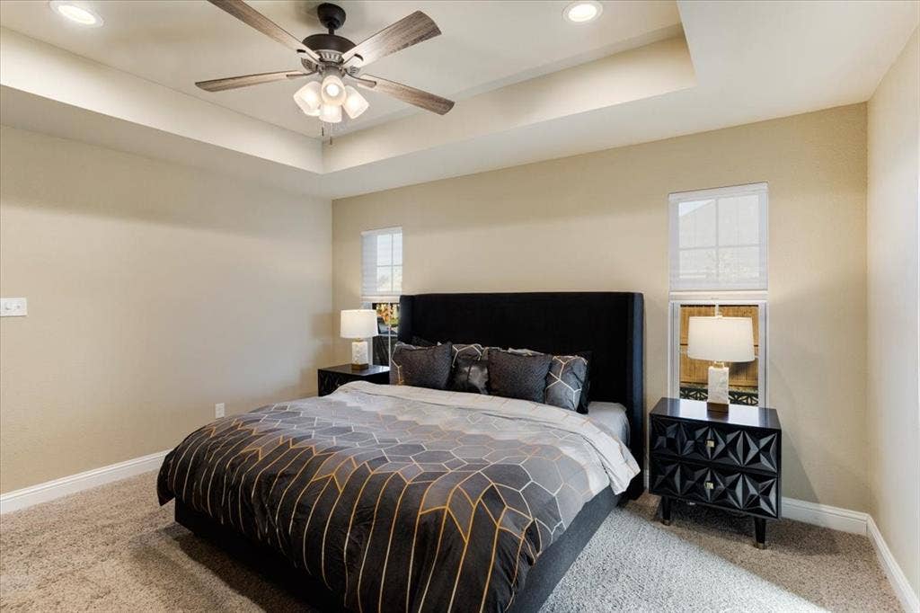 401 Mesa, Lone Oak, TX 75453 Tray ceiling with integrated recessed lighting, central ceiling fan, and carpeted flooring