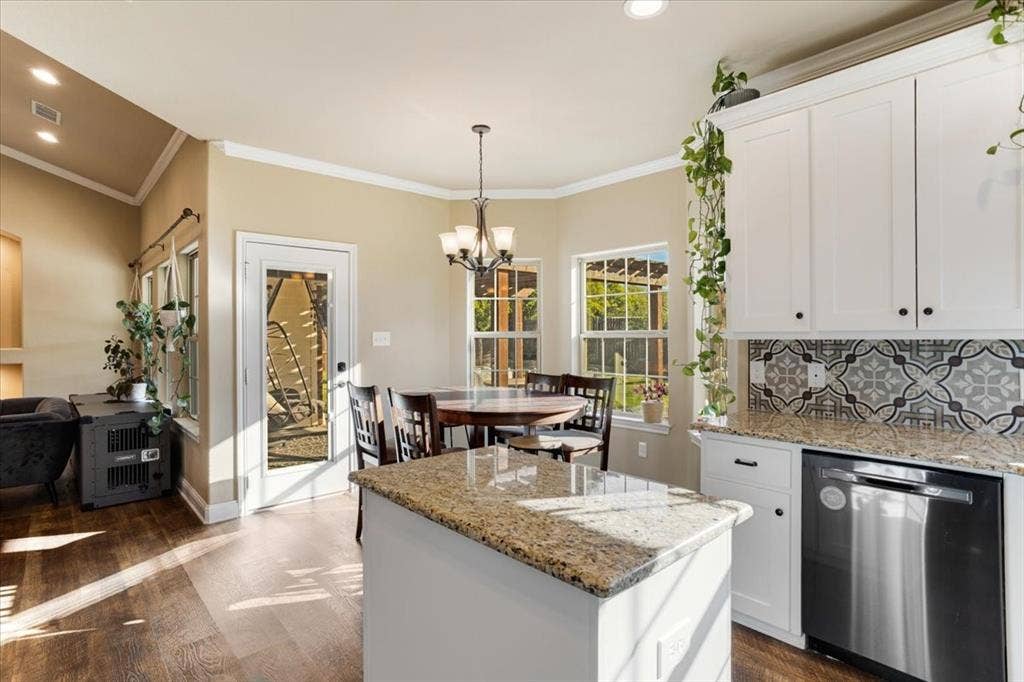 401 Mesa, Lone Oak, TX 75453 Kitchen featuring white cabinetry, stone countertops, patterned tile backsplash, stainless steel dishwasher, and wood-finish flooring