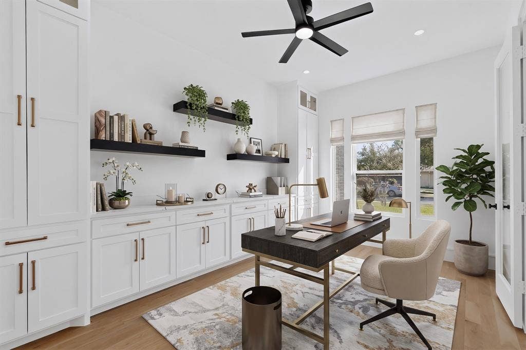 7503 Robin Road, Dallas, TX 75209 Custom white cabinetry with metallic hardware, wood-finish flooring, floating wall shelves, and a ceiling-mounted fan with integrated lighting