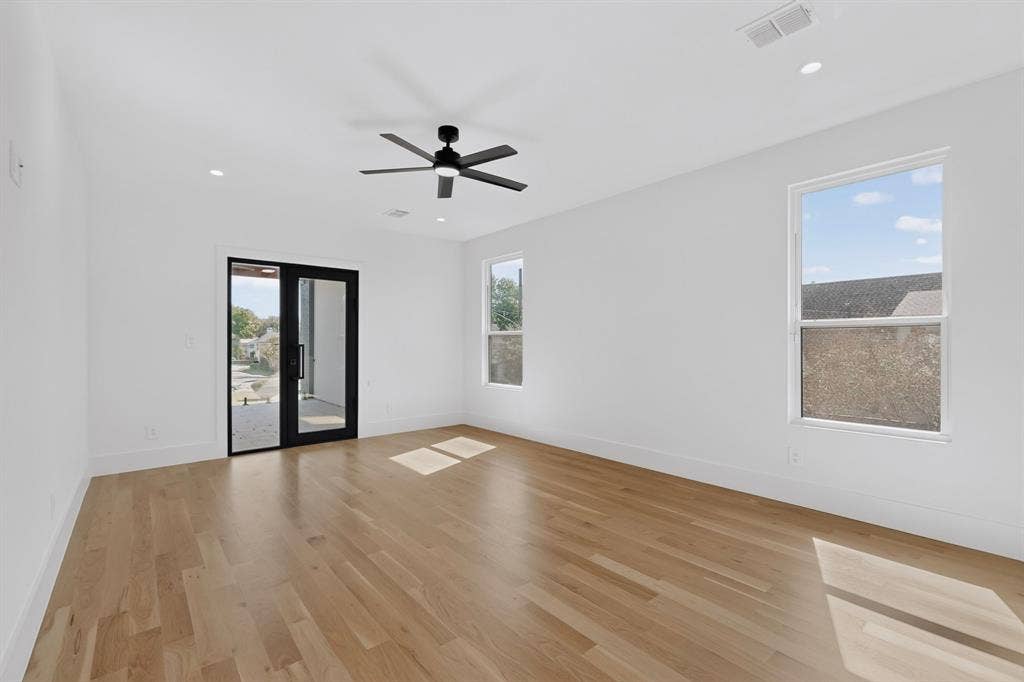 7503 Robin Road, Dallas, TX 75209 Interior space featuring wood-finish flooring, recessed lighting, a matte black ceiling fan, and a glass-paneled exterior door