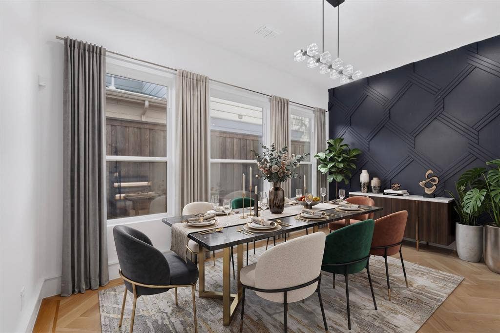 7503 Robin Road, Dallas, TX 75209 Geometric accent wall with detailed molding, wood-finish flooring in a herringbone pattern, linear multi-light chandelier, and large windows