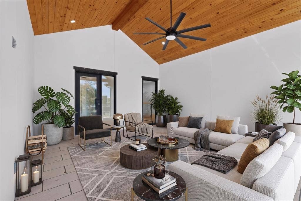 7503 Robin Road, Dallas, TX 75209 Covered patio featuring a vaulted wood-plank ceiling, recessed lighting, matte black multi-blade ceiling fan, and large-format tile flooring