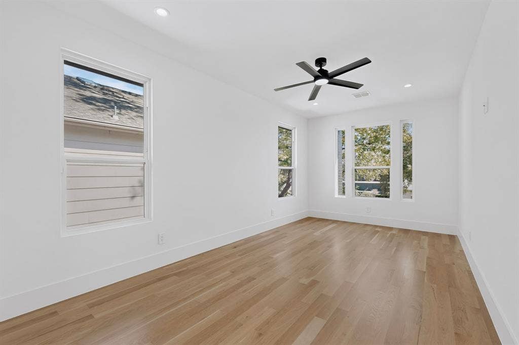 7503 Robin Road, Dallas, TX 75209 Interior space featuring wood-finish flooring, recessed lighting, and a modern ceiling fan with integrated lighting