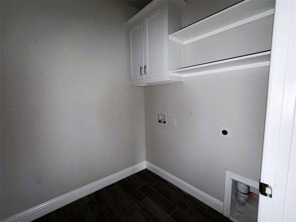 3728 Walnut Ridge Drive, Grand Prairie, TX 76065 Separate utility room has plenty of shelf and cabinet storage and room for full size washer and dryer.