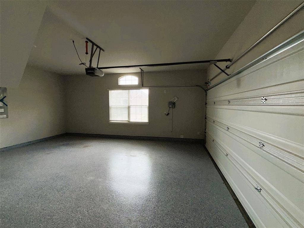 3728 Walnut Ridge Drive, Grand Prairie, TX 76065 Easy-to-clean epoxy covers the floor of the 2-car garage.