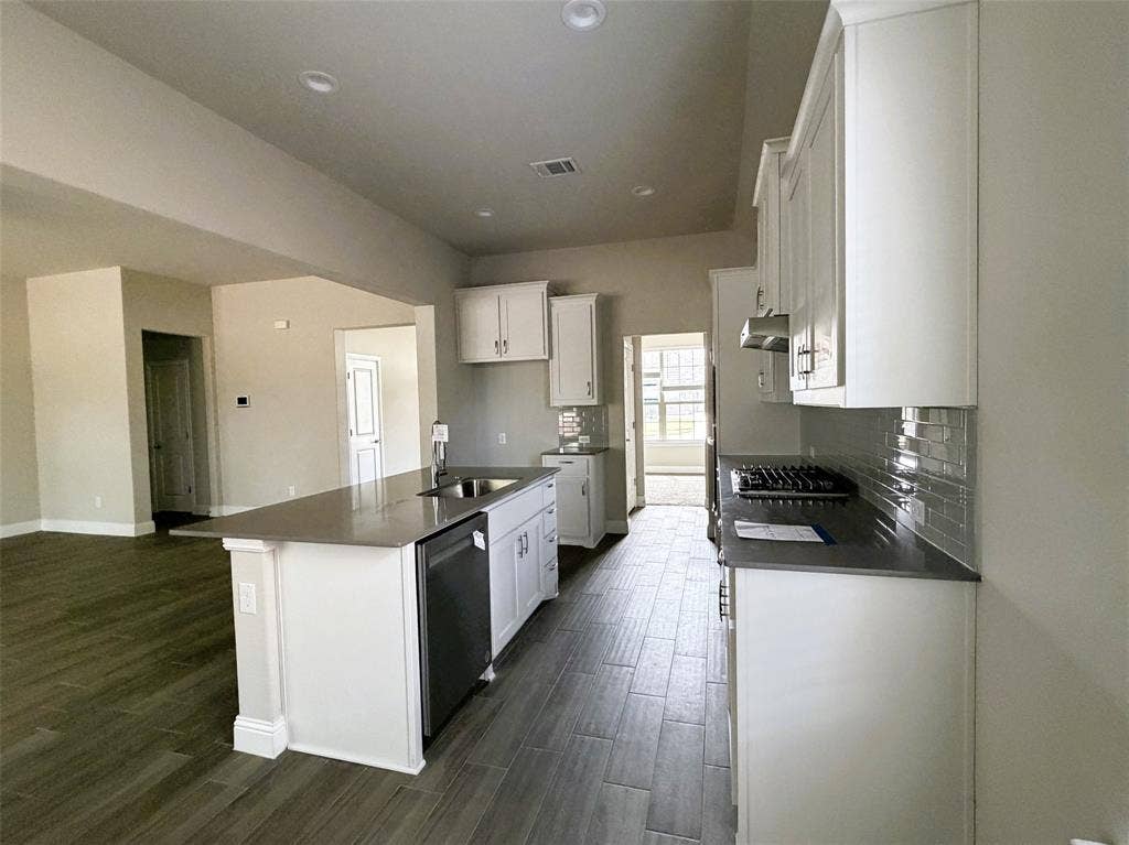 3728 Walnut Ridge Drive, Grand Prairie, TX 76065 Island with breakfast bar transforms into a serving buffet during meals and gatherings.
