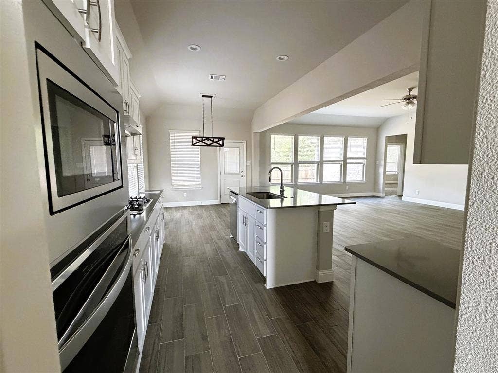 3728 Walnut Ridge Drive, Grand Prairie, TX 76065 Chef's kitchen with quartz counters is open to living, perfect for holiday entertaining.