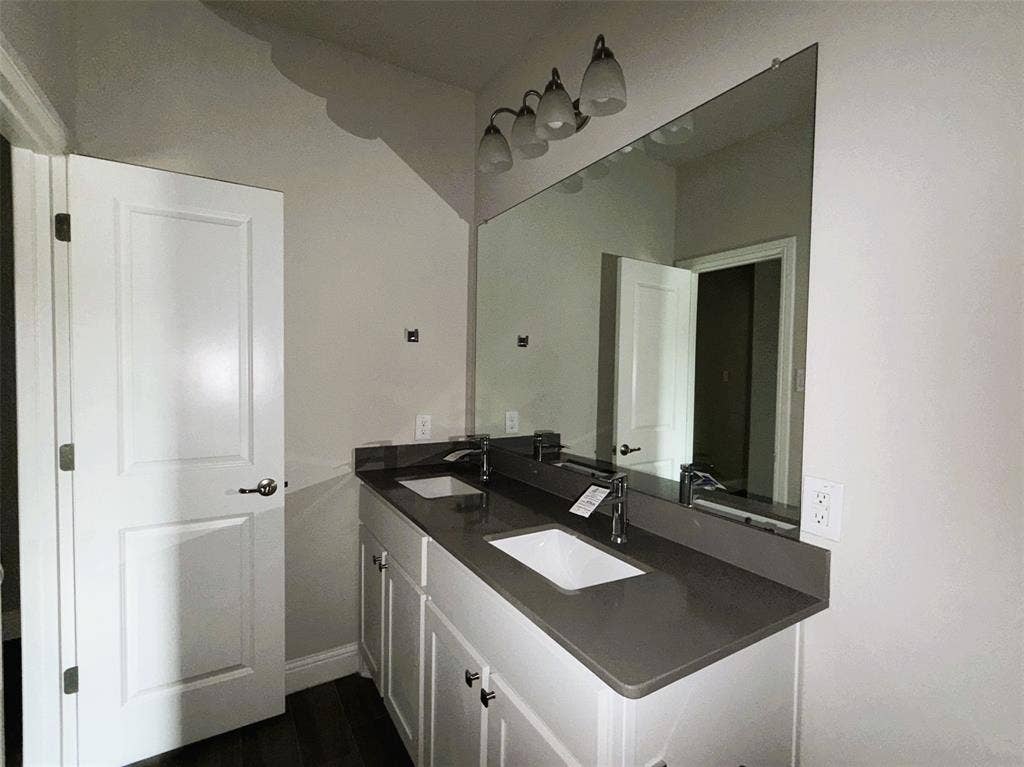 3728 Walnut Ridge Drive, Grand Prairie, TX 76065 Reverse view shows off extended vanity with dual sinks and plenty of storage.