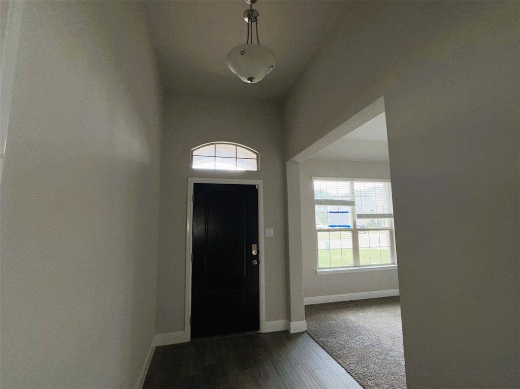 3728 Walnut Ridge Drive, Grand Prairie, TX 76065 Grand entry with formal dining at right.