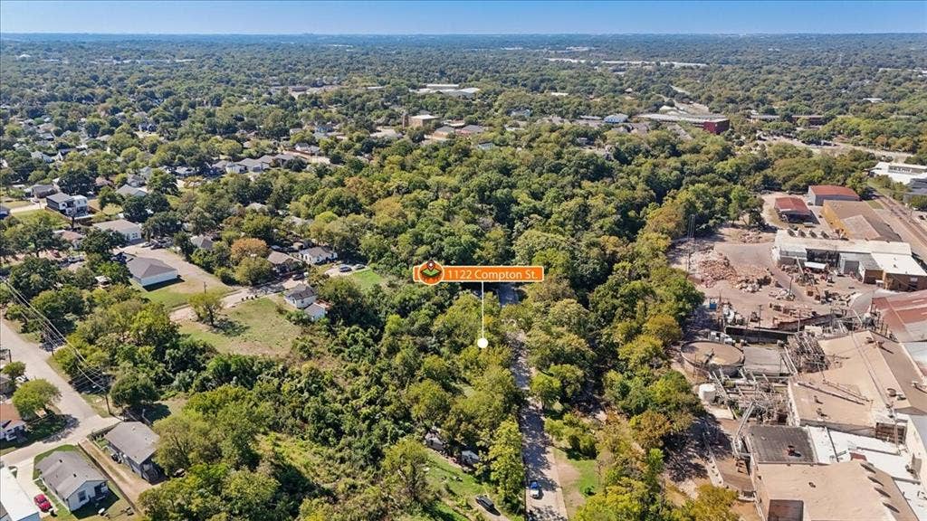 1122 Compton Street, Dallas, TX 75203 Aerial perspective of a wooded lot featuring dense mature tree cover and direct access to an established street