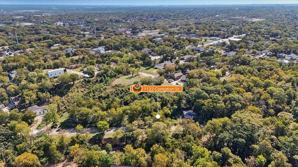 1122 Compton Street, Dallas, TX 75203 Aerial perspective of a lot featuring mature trees and established greenery