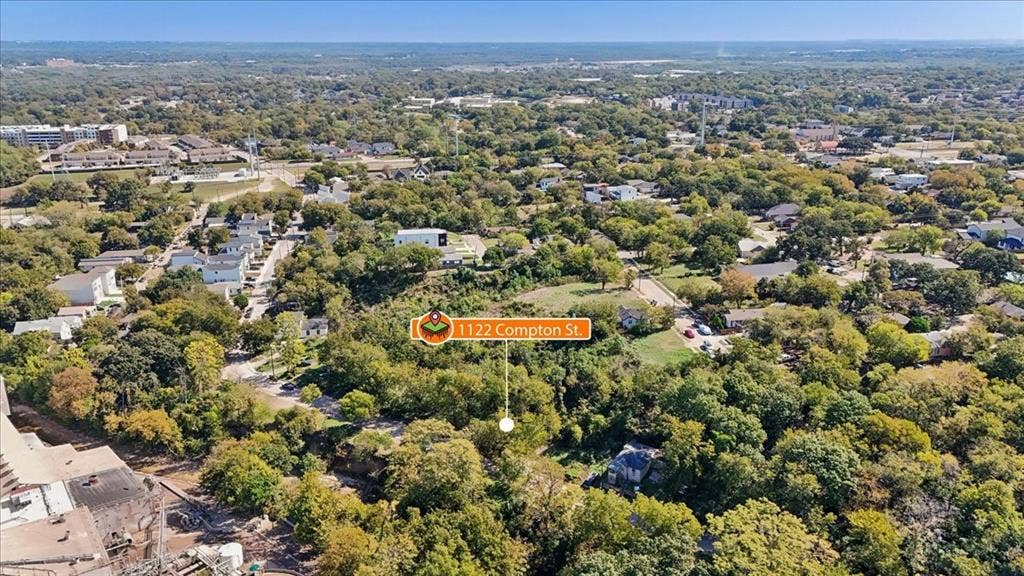 1122 Compton Street, Dallas, TX 75203 Aerial perspective of expansive treed lot featuring native vegetation and established canopy