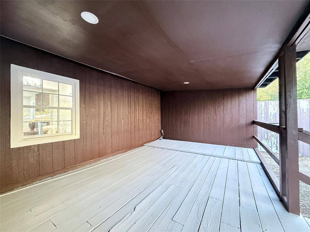 4522 Idaho Avenue, Dallas, TX 75216 Covered deck featuring wood-panel siding, recessed lighting, and painted wood-plank flooring