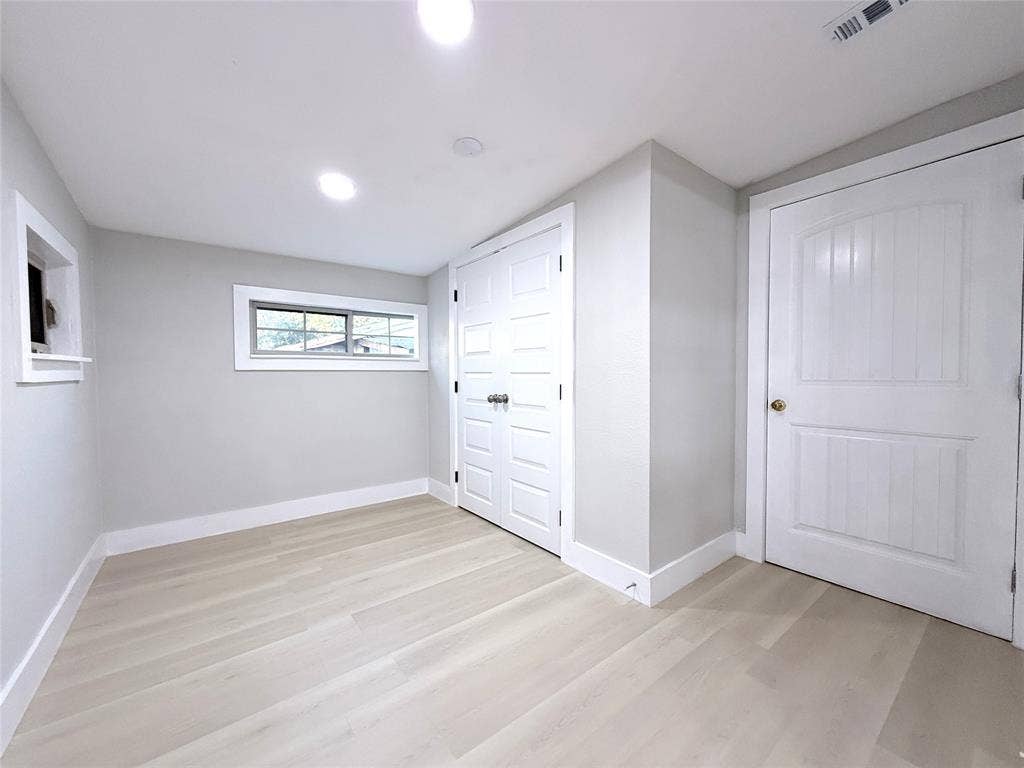 4522 Idaho Avenue, Dallas, TX 75216 Light-toned wood-finish flooring, recessed lighting, double closet with multi-panel doors, and single-panel interior door