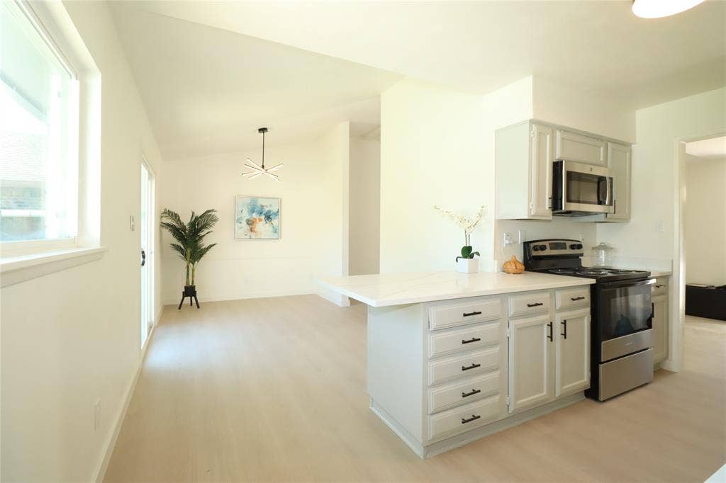 1518 Burgundy Street, Garland, TX 75040 Gorgeous countertops, new stainless steel appliances and fixtures!!