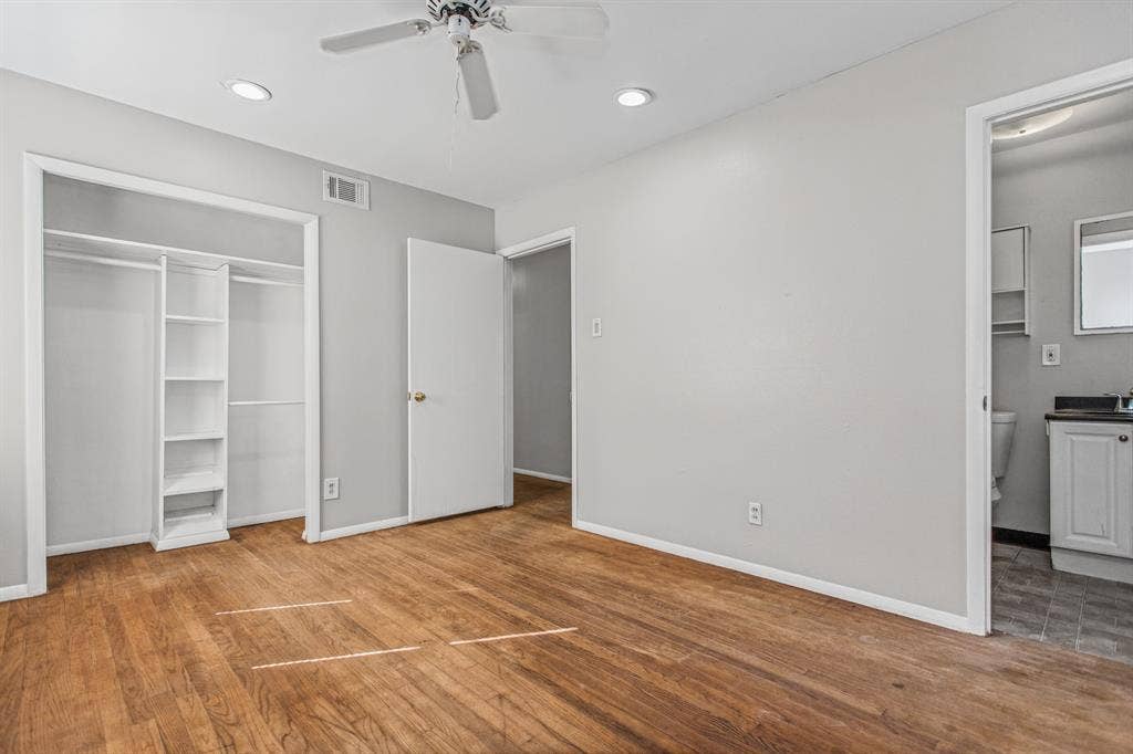 1220 Colfax Circle, Richardson, TX 75080 Wood-finish flooring, recessed lighting, ceiling fan, and built-in closet shelving