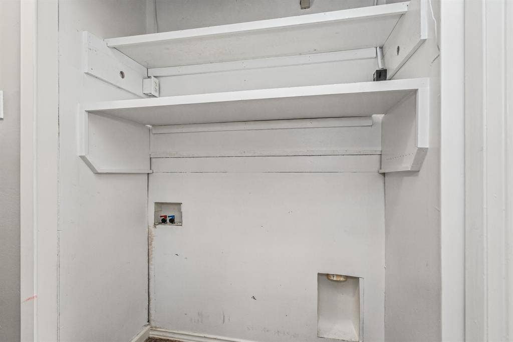 1220 Colfax Circle, Richardson, TX 75080 Recessed utility hookups featuring dual built-in white shelving units