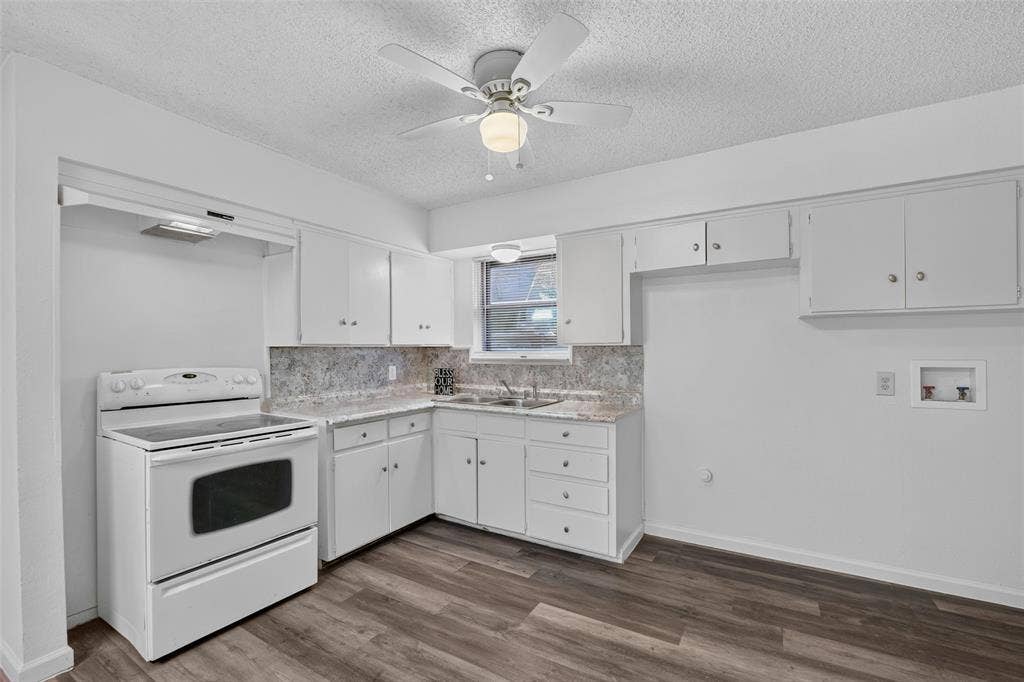 3532 Hilton Drive, Mesquite, TX 75150 Kitchen featuring white cabinetry, stone-finish countertops, wood-finish flooring, an integrated electric range, and a ceiling-mounted fan