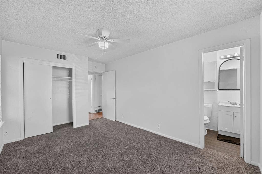 3532 Hilton Drive, Mesquite, TX 75150 Room featuring wall-to-wall carpeting, ceiling fan with integrated lighting, and sliding-door closet