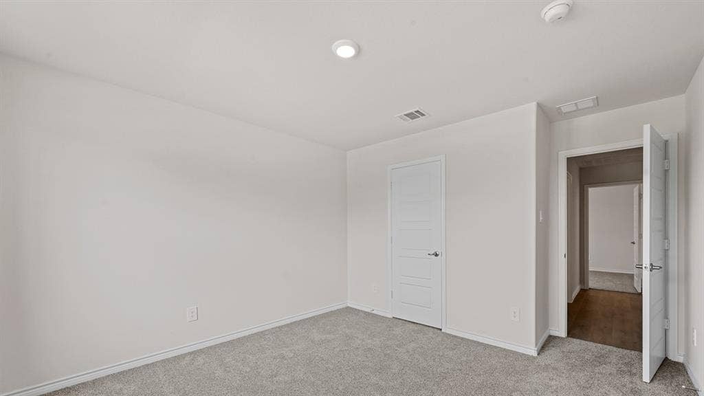 Recessed lighting and light gray walls