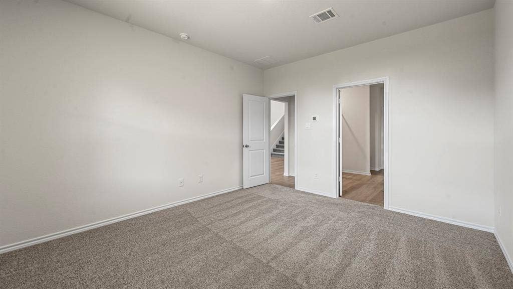 5727 Sunshine Lane, Crandall, TX 75114 Neutral wall paint, gray carpet flooring, white trim, and white interior doors