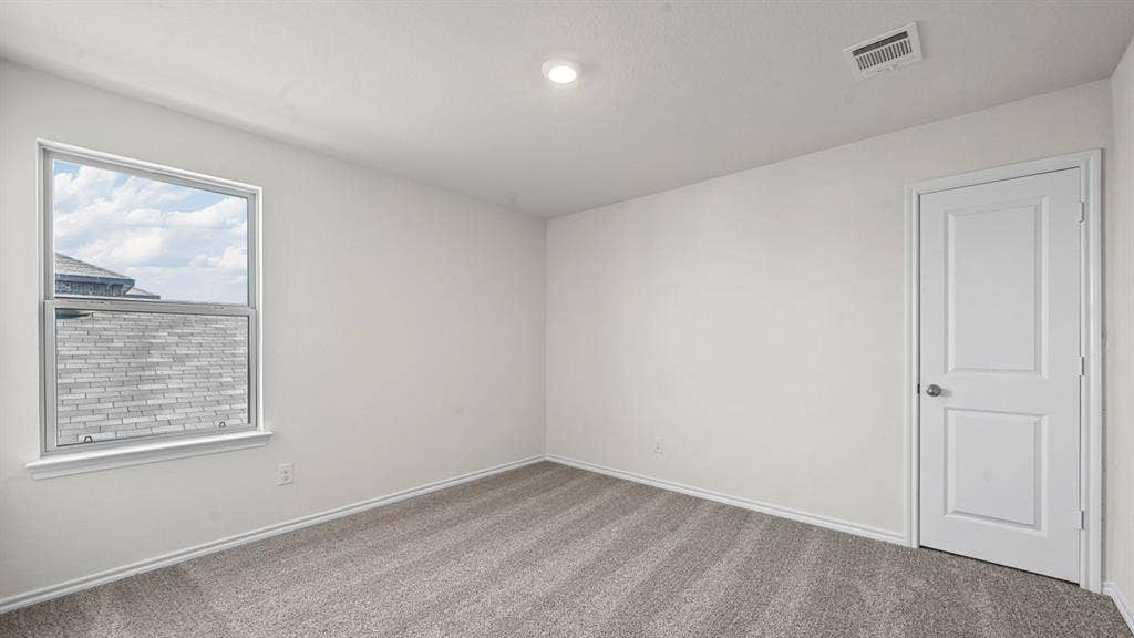 5727 Sunshine Lane, Crandall, TX 75114 Recessed lighting, light gray carpeting, single window, white paneled door, and white painted walls
