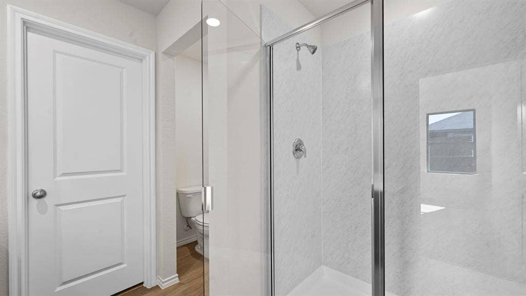5731 Sunshine Lane, Crandall, TX 75114 Glass-enclosed shower with a chrome fixture