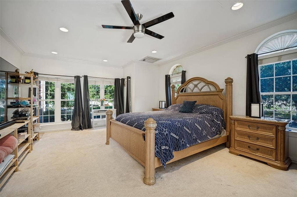 1957 E Fm 550, Rockwall, TX 75032 Spacious interior featuring recessed lighting, a modern ceiling fan, crown molding, and large windows with arched transoms
