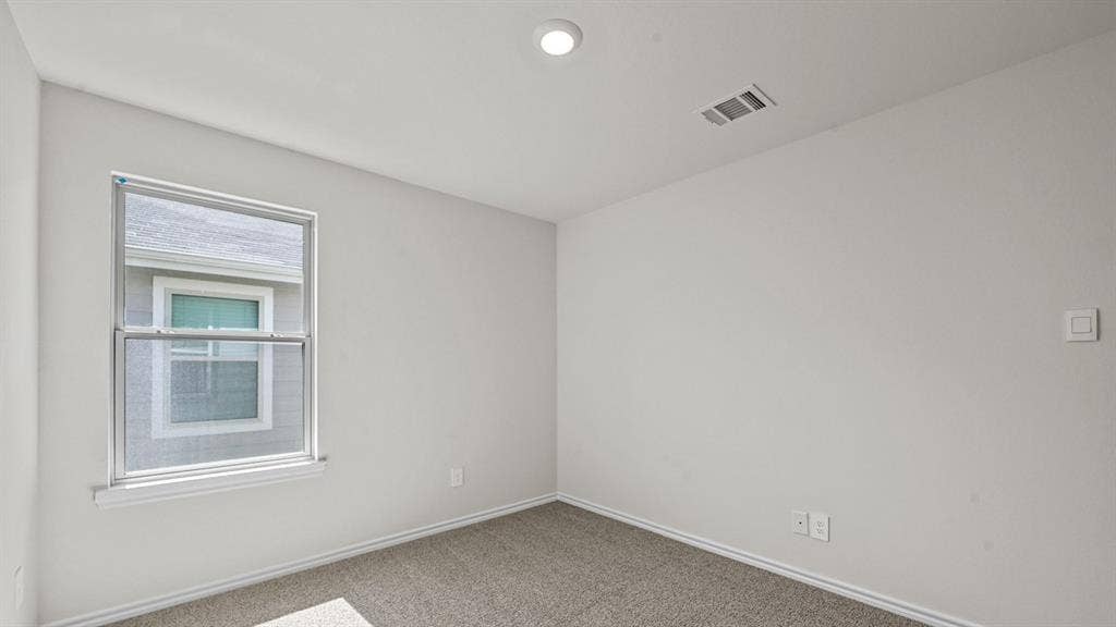 5743 Sunshine Lane, Crandall, TX 75114 Neutral wall finish, recessed ceiling lighting, light gray carpet, double-hung window with screens, white window trim