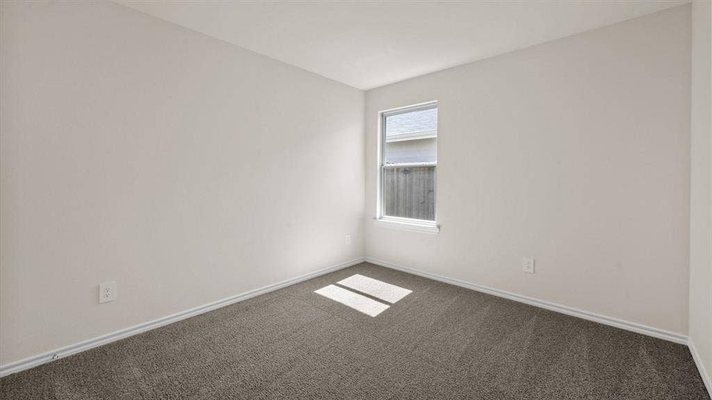 5743 Sunshine Lane, Crandall, TX 75114 Neutral-toned walls, single-pane window, and carpeted flooring