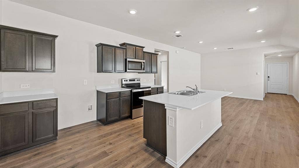 5743 Sunshine Lane, Crandall, TX 75114 Kitchen with dark wood-finish cabinetry, white countertops, and stainless steel appliances