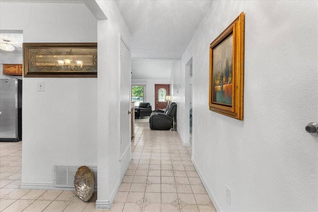 2702 Pebble Beach Drive, Lancaster, TX 75134 Ceramic tile flooring, neutral wall finishes, and interior passage doors
