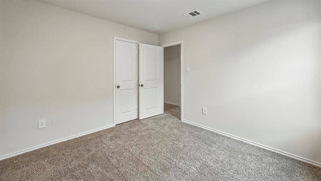 2620 Ocean View Grove, Crandall, TX 75114 Neutral-toned interior room featuring light gray carpeting and white baseboards