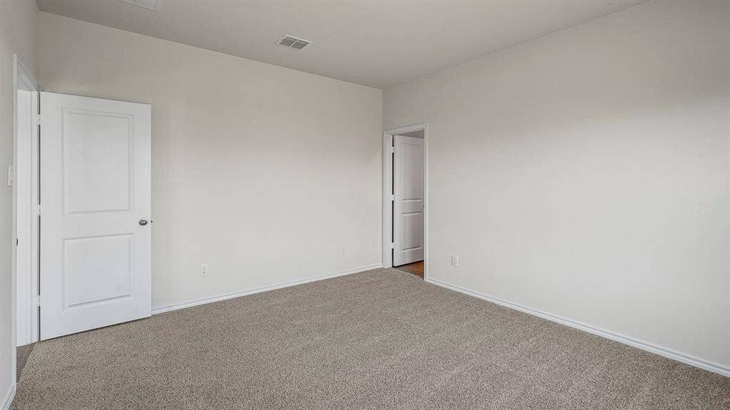 235 Whispering Pine Drive, Royse City, TX 75189 Neutral interior featuring neutral wall paint, wall-to-wall carpeting, and two-panel interior doors