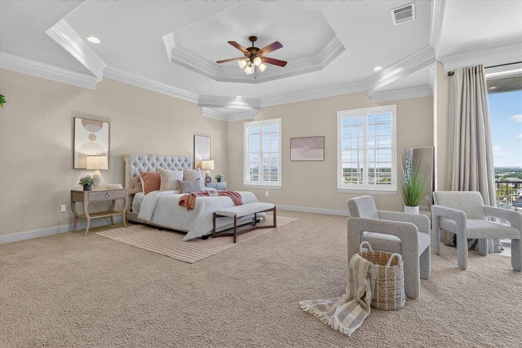 563 Rockingham Drive, Irving, TX 75063 Tray ceiling with crown molding, recessed lighting, central ceiling fan, and multi-pane windows with plantation shutters