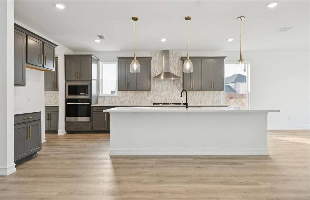 2634 Creekdale Drive, Celina, TX 75009 *Floorplan representation, not actual home - Spacious kitchen with eat-in bartop island