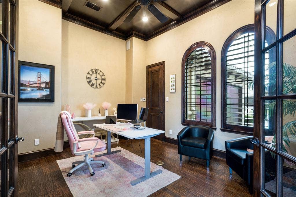 6590 Gerrard Street, Frisco, TX 75034 Rich wood-finish flooring, high coffered ceiling with dark wood detailing, arched dual-pane windows, and solid wood French entry doors