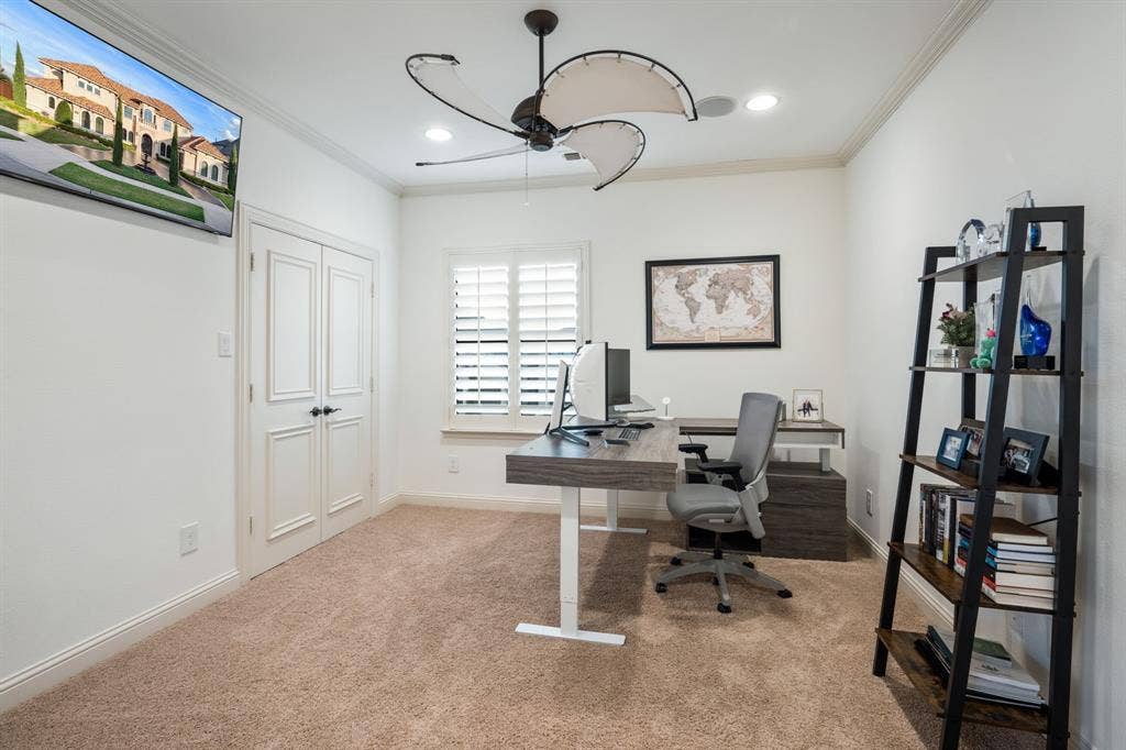 6590 Gerrard Street, Frisco, TX 75034 Room featuring plush wall-to-wall carpeting, crown molding, double doors, window plantation shutters, and a multi-blade ceiling fan with integrated lighting