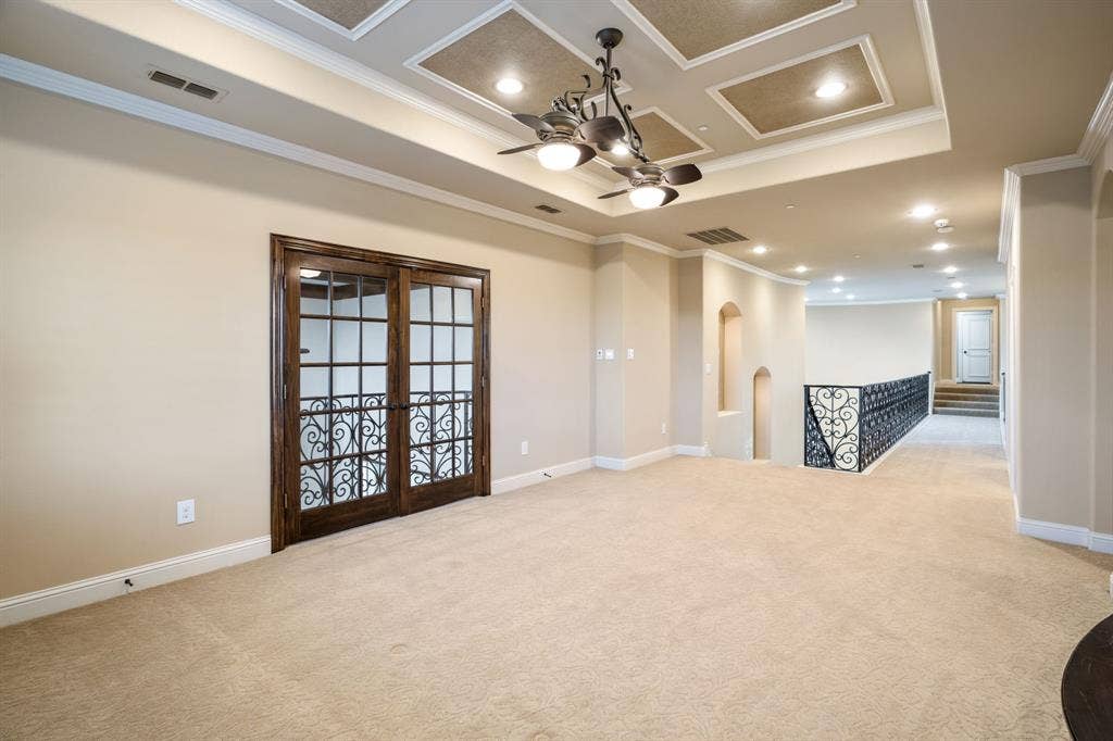 6590 Gerrard Street, Frisco, TX 75034 Coffered ceiling featuring recessed lighting, decorative chandelier, double French doors with glass panes, and ornate metal stair railing