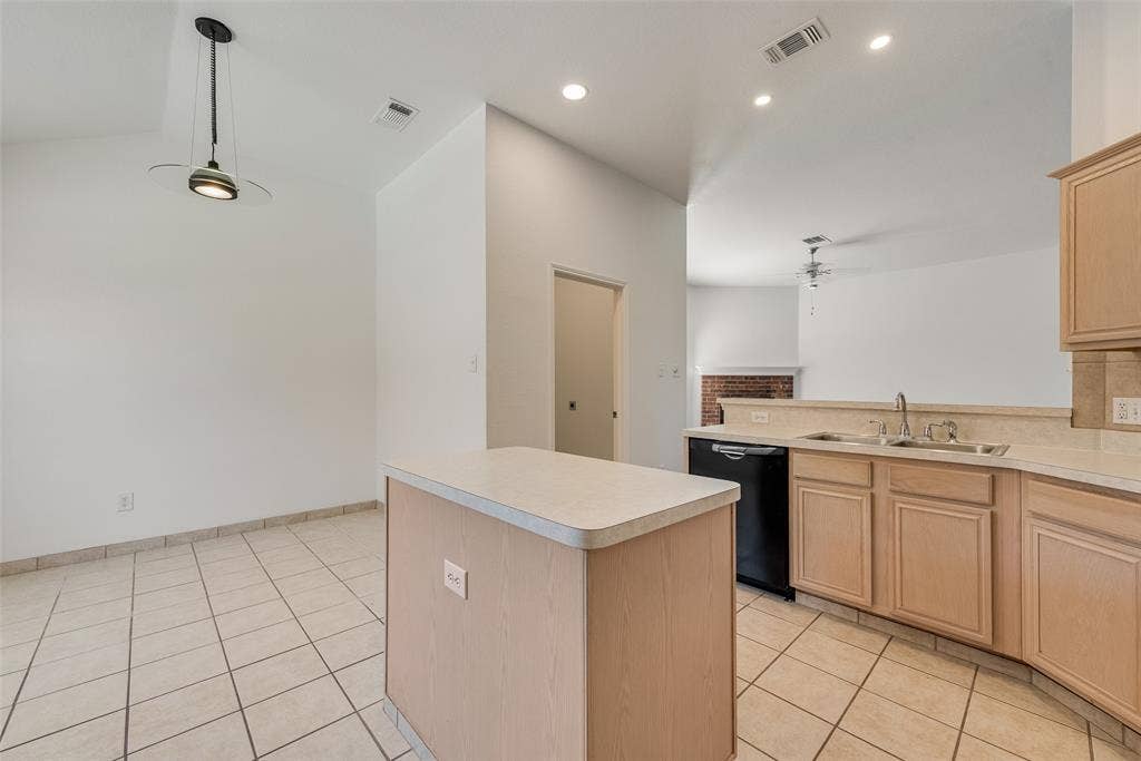 412 Overland Trail, Cedar Hill, TX 75104 Kitchen featuring a central island, light-finish cabinetry, tile flooring, recessed lighting, and a pendant fixture
