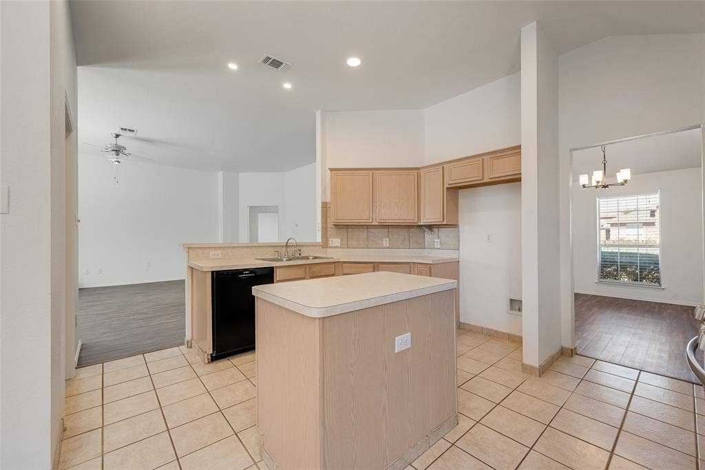 412 Overland Trail, Cedar Hill, TX 75104 Kitchen featuring light-finish cabinetry, a center island with a neutral countertop, ceramic tile flooring, recessed lighting, and a stainless steel sink with a goose-neck faucet