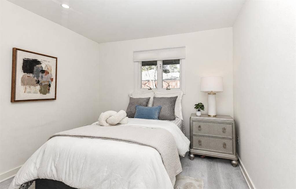 13936 Tanglewood Place, Farmers Branch, TX 75234 2nd Bedroom has neutral-toned interior featuring wood-finish flooring, recessed lighting, and a dual-pane window with a roller shade