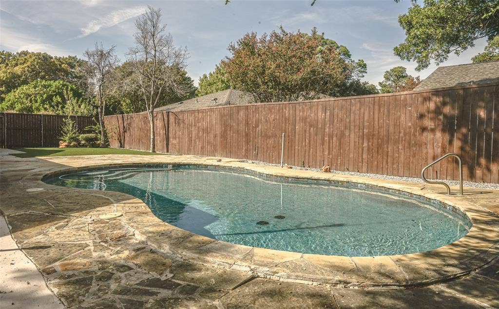 13936 Tanglewood Place, Farmers Branch, TX 75234 Imagine the fun-filled days ahead , enjoying your backyard with low maintenance and lovely inground pool with flagstone coping, full wood-plank fencing for privacy